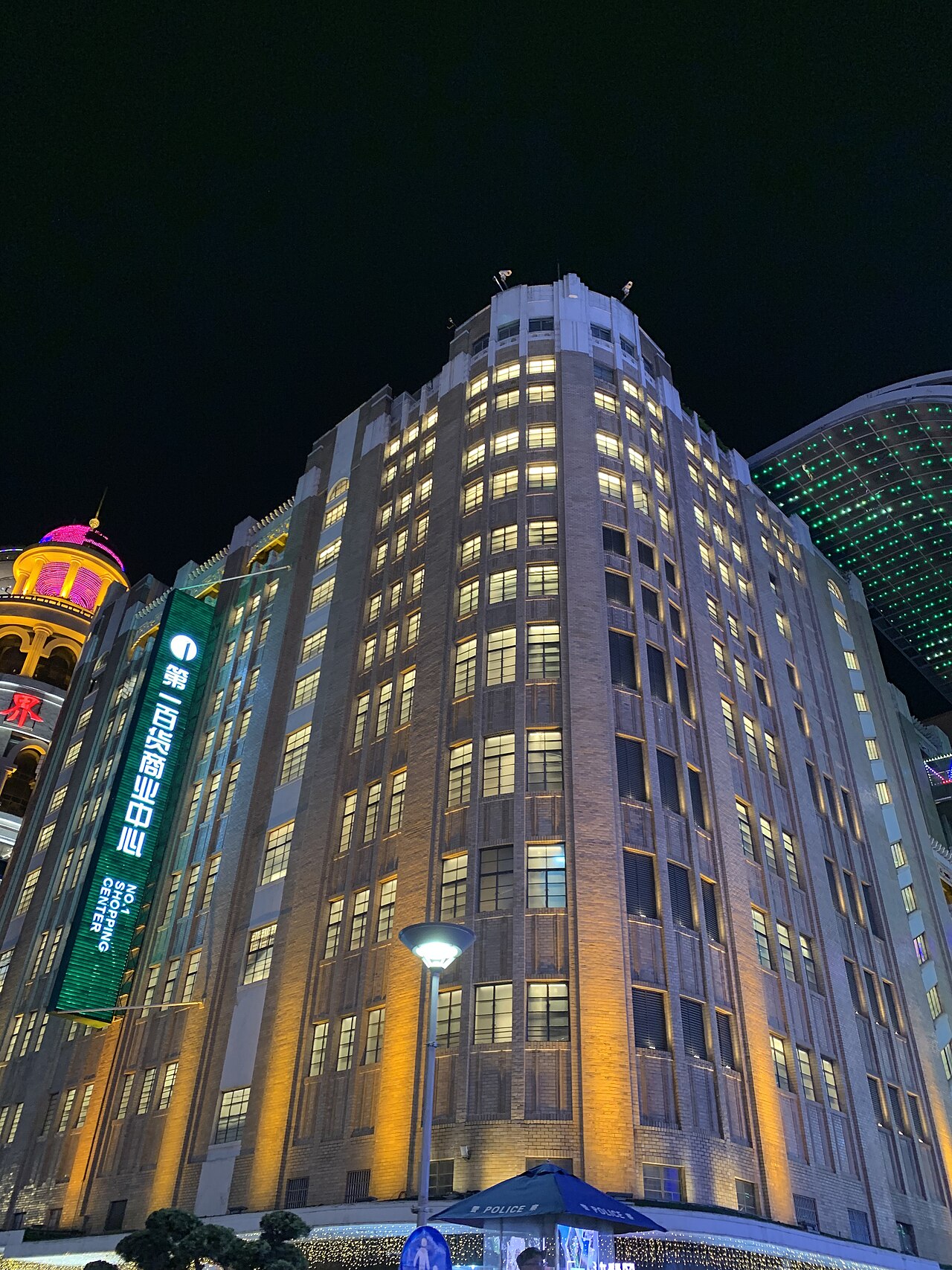 Crowds and illuminated storefronts on East Nanjing Road in Shanghai at night